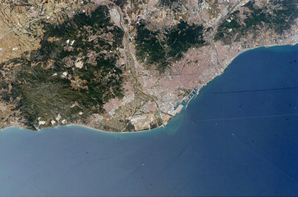 Barcelona hugging the Mediterranean Sea, a great place to bring your Pillowpacker travel pillow 