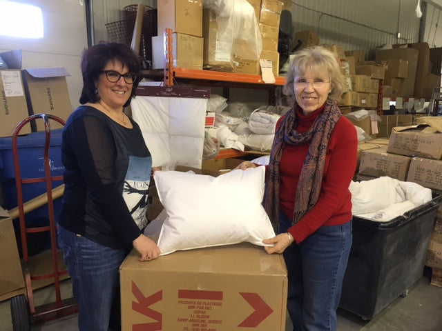 Nancy Simon of Marie L'Oie poses with a pillowpacker pillow