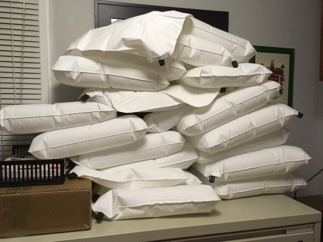 A stack of slightly deflated pillow liners