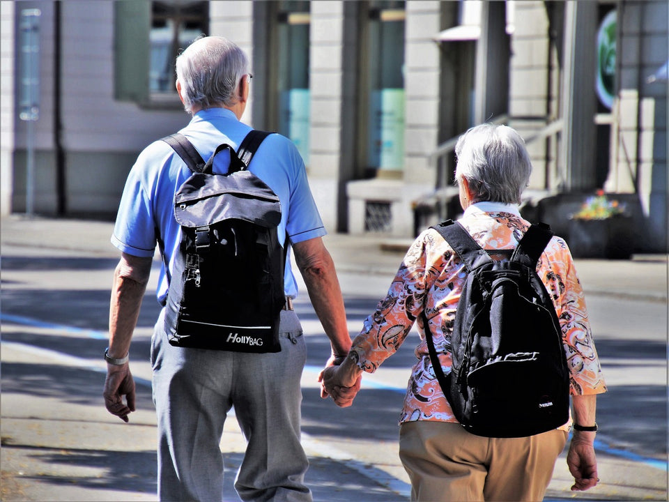 Older couple holding hands